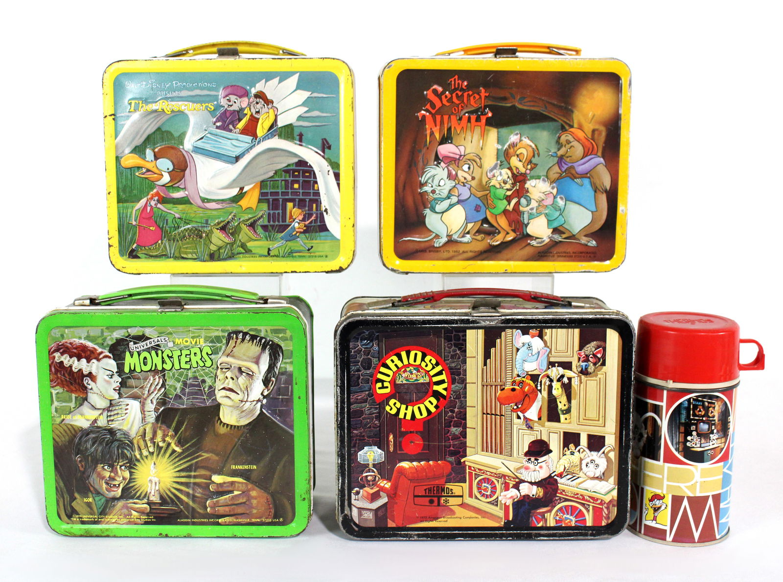 Tin Lunchboxes incl. Monsters, Curiosity Shop, The Rescuers and Secret of Nimh (1 of 2)