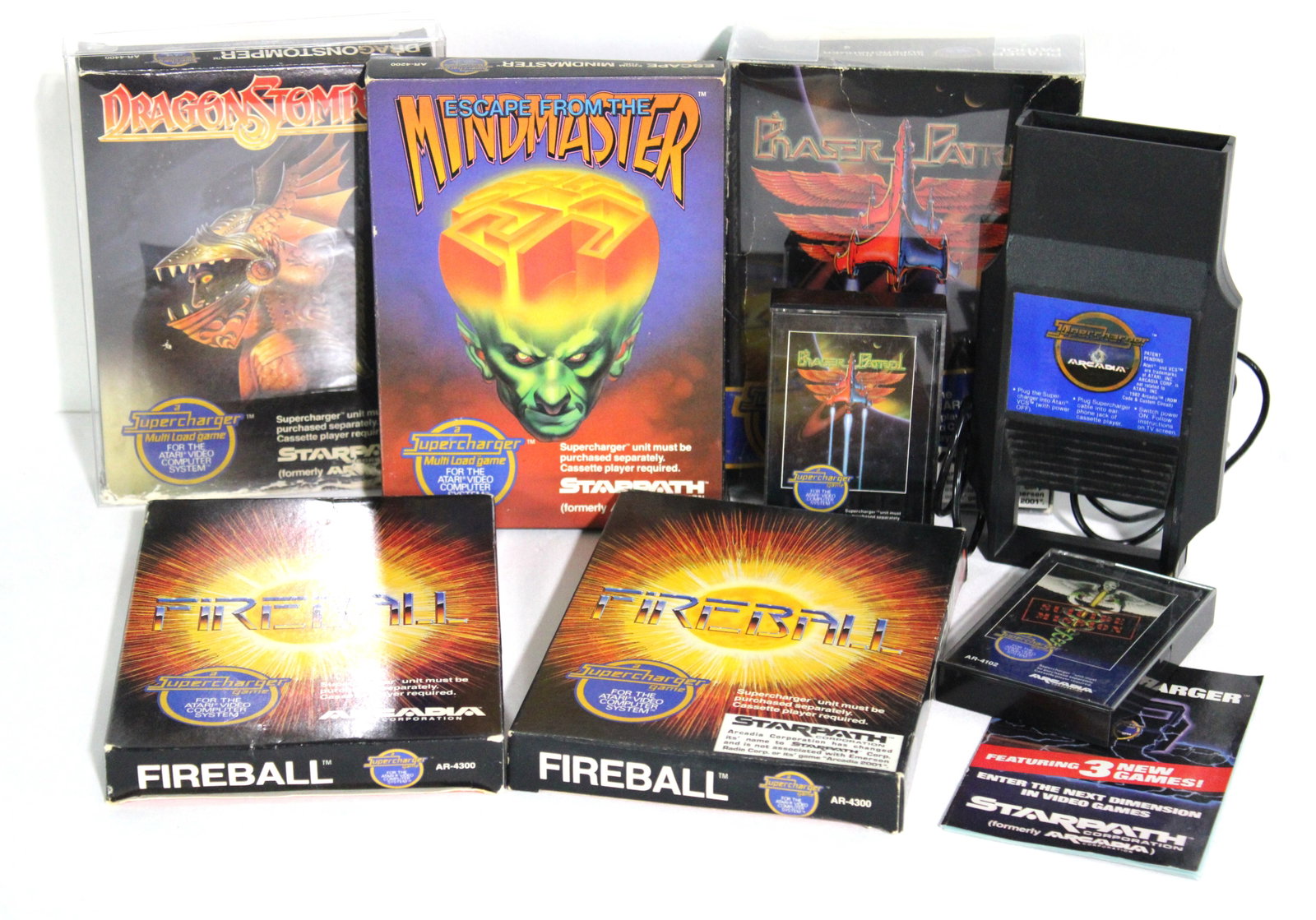 Atari Supercharger and 5 Games: Lot includes.. • Starpath Supercharger and Phaser Patrol Game w/Box & Papers• Starpath Dragonstomper Game w/Box & Papers• Starpath Escape from the Mindmaster Game w/Box & Papers• S