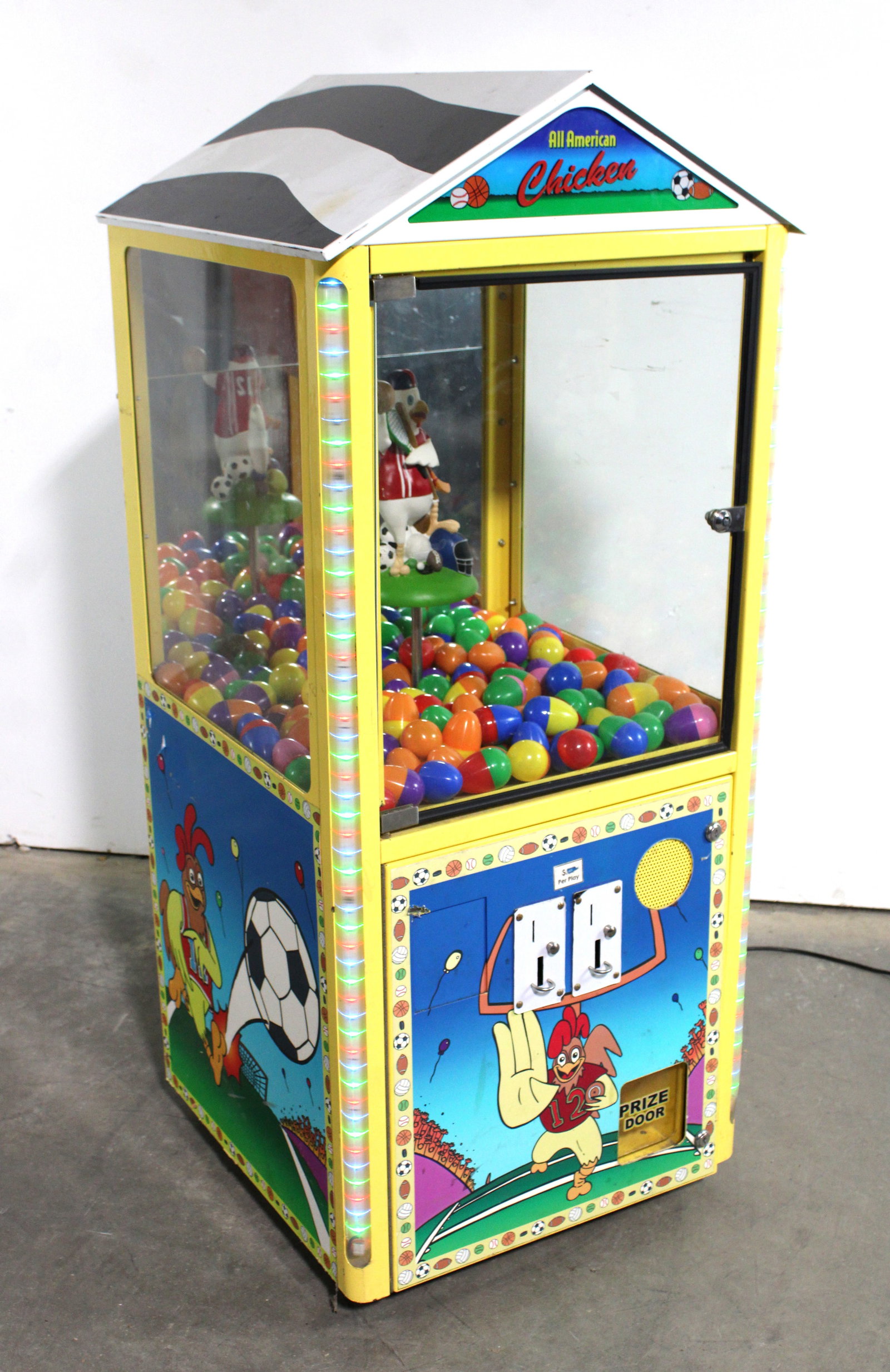 All American Chicken Prize Arcade: Powers on. Locked no key. This item requires third-party shipping or pickup arrangements to be made. Dimensions: 51 x 22 x 22