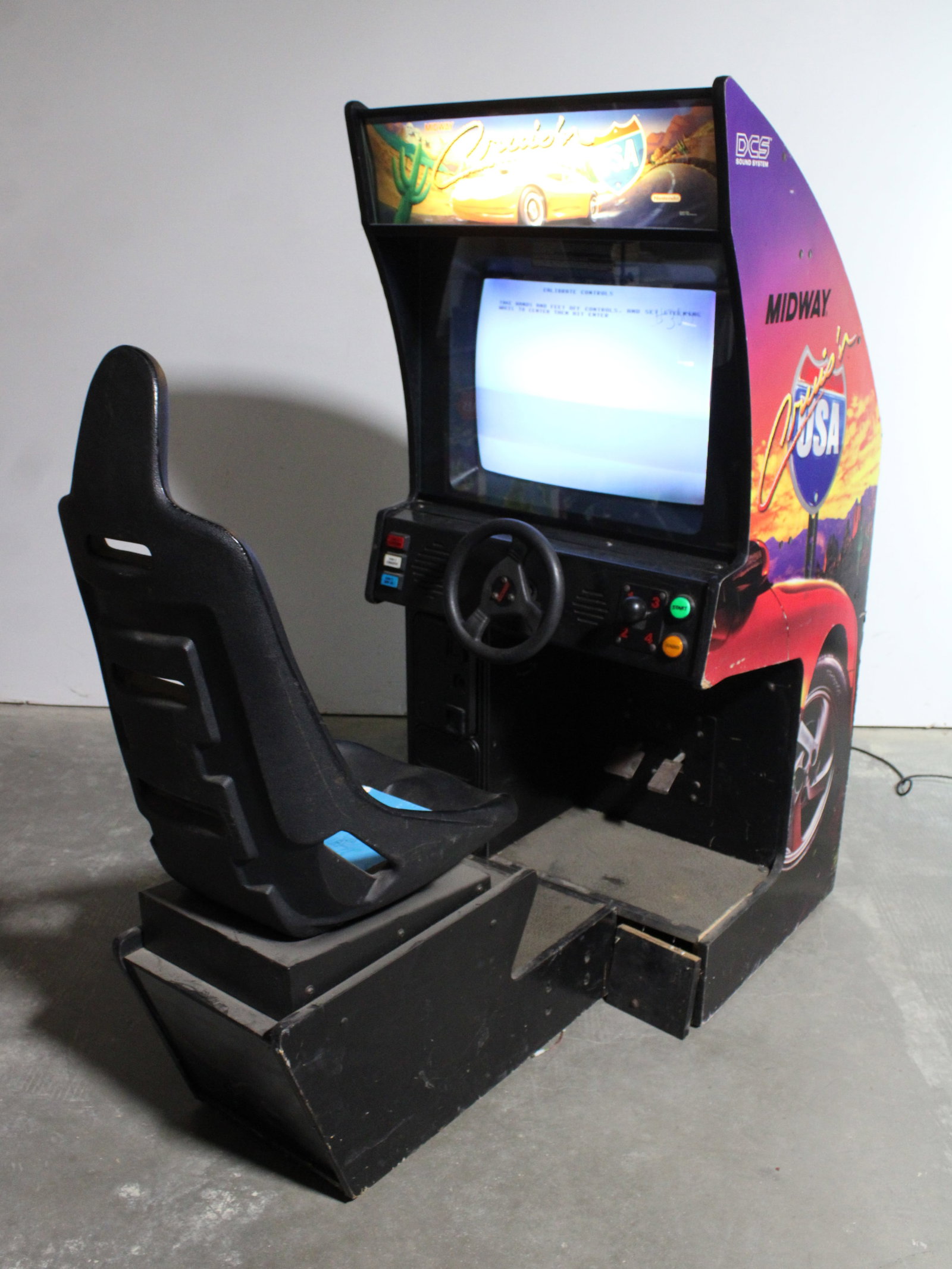 Cruis'n USA Sit Down Racing Arcade: Powers on, stalls at boot screen. Won't calibrate. This item requires third-party shipping or pickup arrangements to be made. Dimensions: 68 x 31 x 63