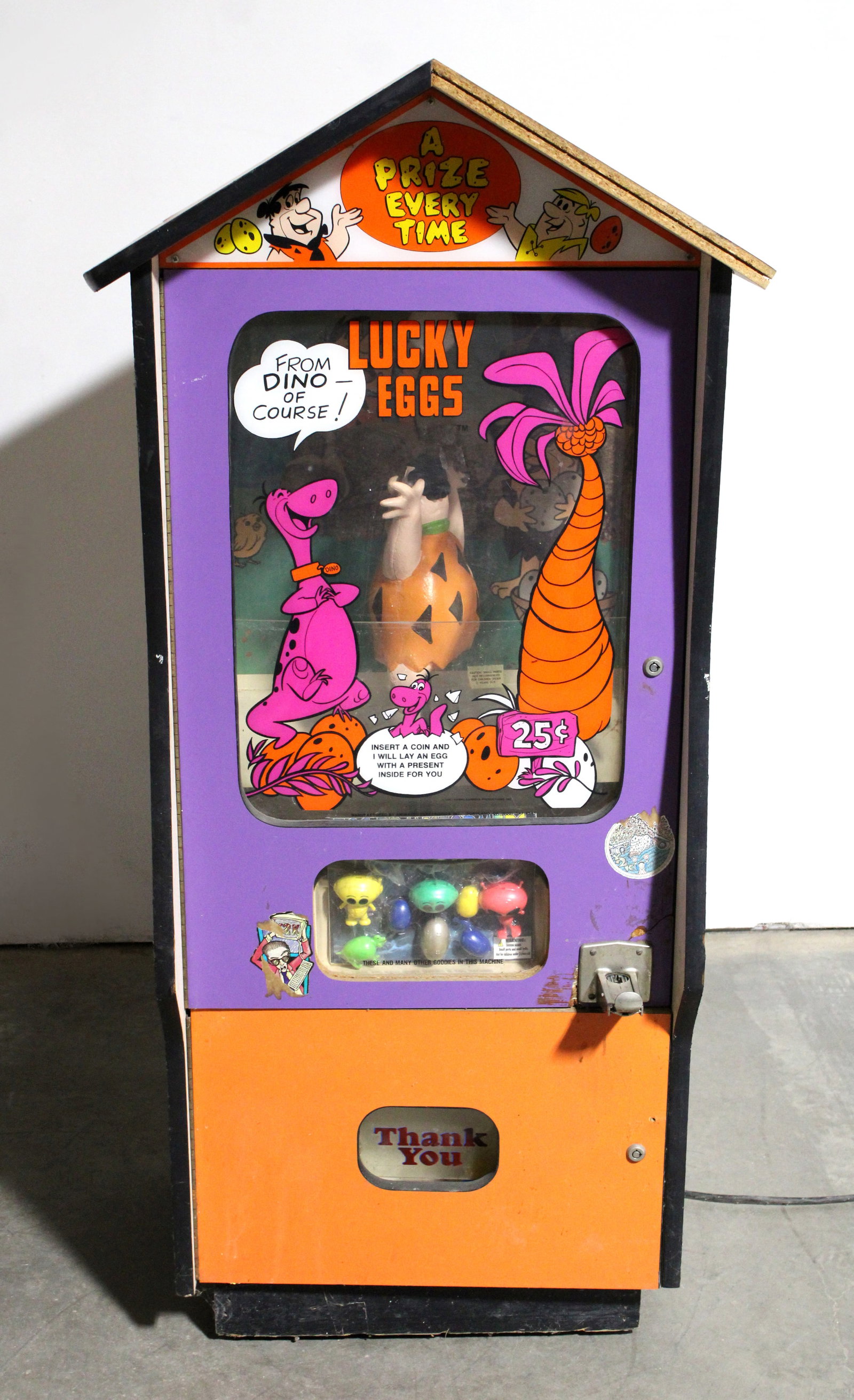 Flintstones Lucky Eggs Prize Arcade: Working, sound humming. Bottom is unlocked, no key for top. Needs cleaning. This item requires third-party shipping or pickup arrangements to be made. Dimensions: 58 x 27 x 25