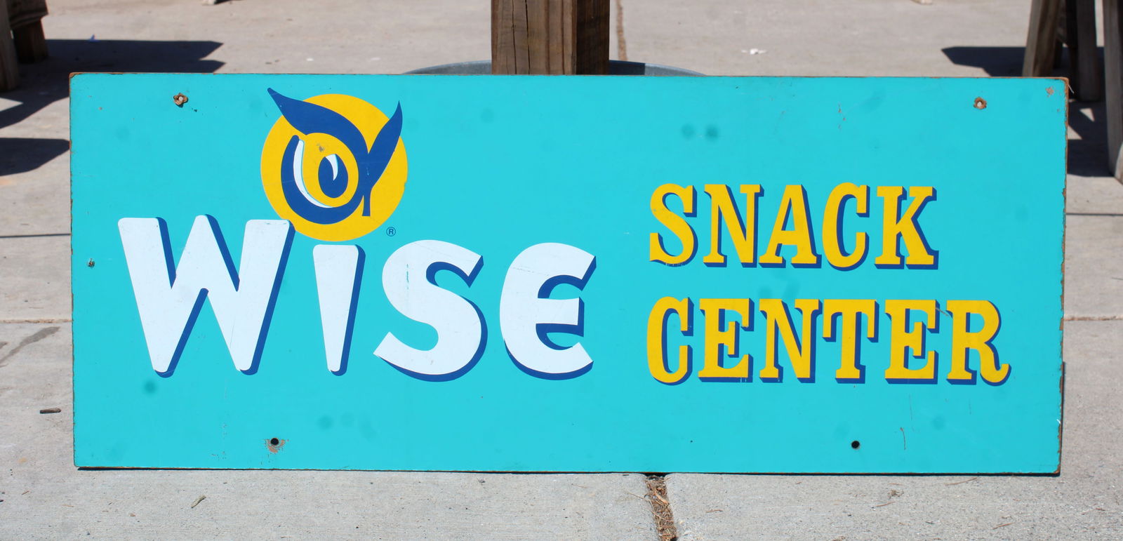 Wise Snack Center Masonite Sign: This item requires third-party shipping or pickup arrangements to be made. Dimensions: 14 x 35