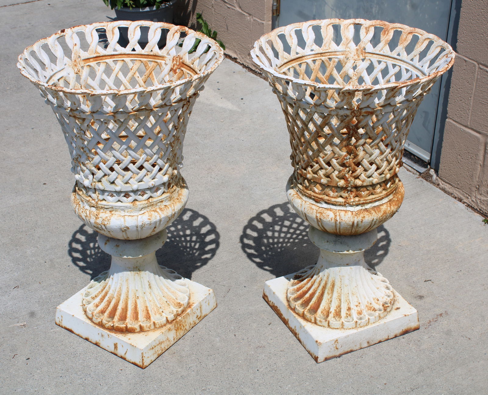 Antique Cast Iron Garden Urns: This item requires third-party shipping or pickup arrangements to be made. Dimensions: 27 x 17 x 17