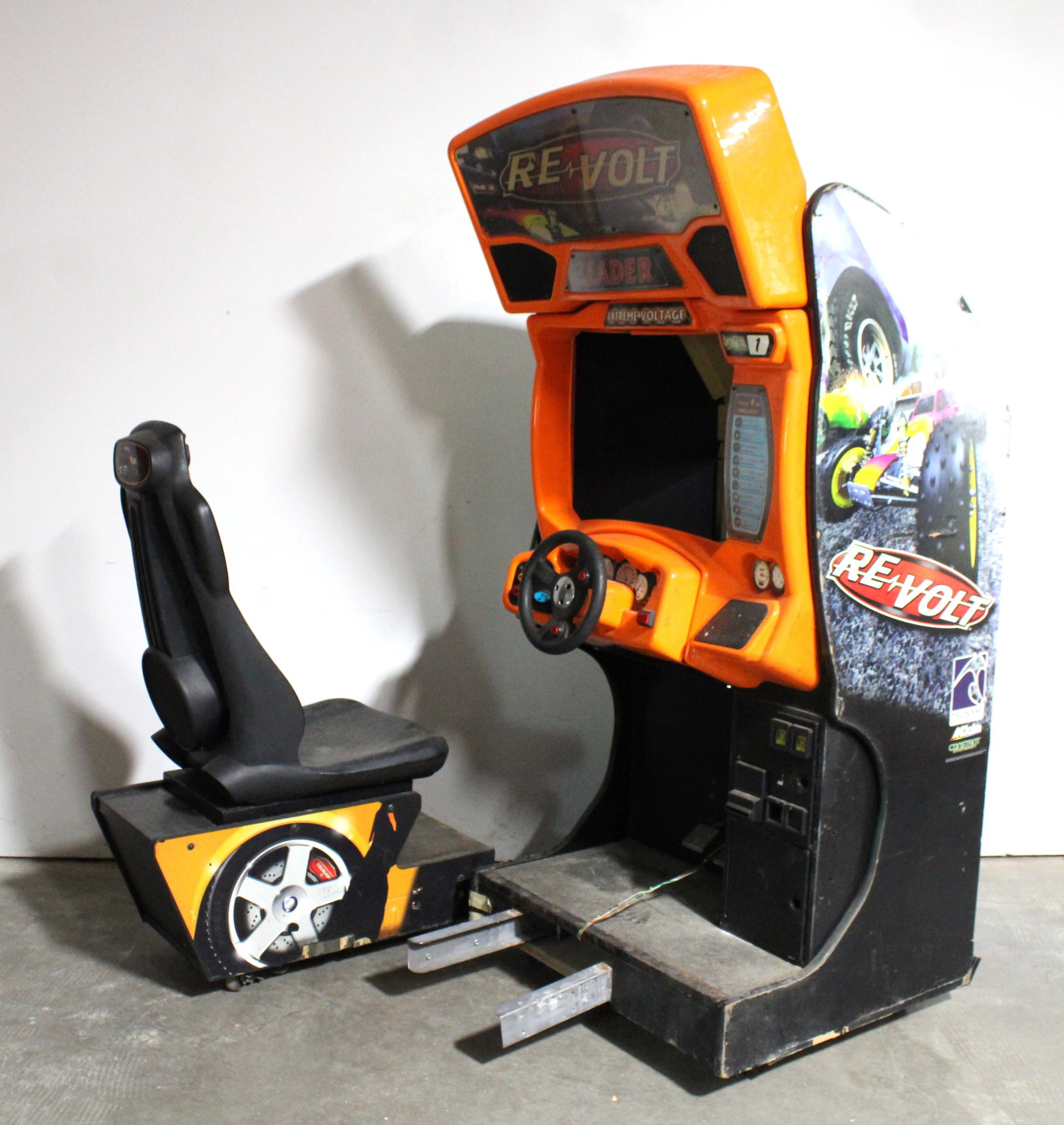 Revolt Sit Down Racing Arcade Game: No monitor. For parts or repair. This item requires third-party shipping or pickup arrangements to be made. Dimensions: 76 x 34 x 66