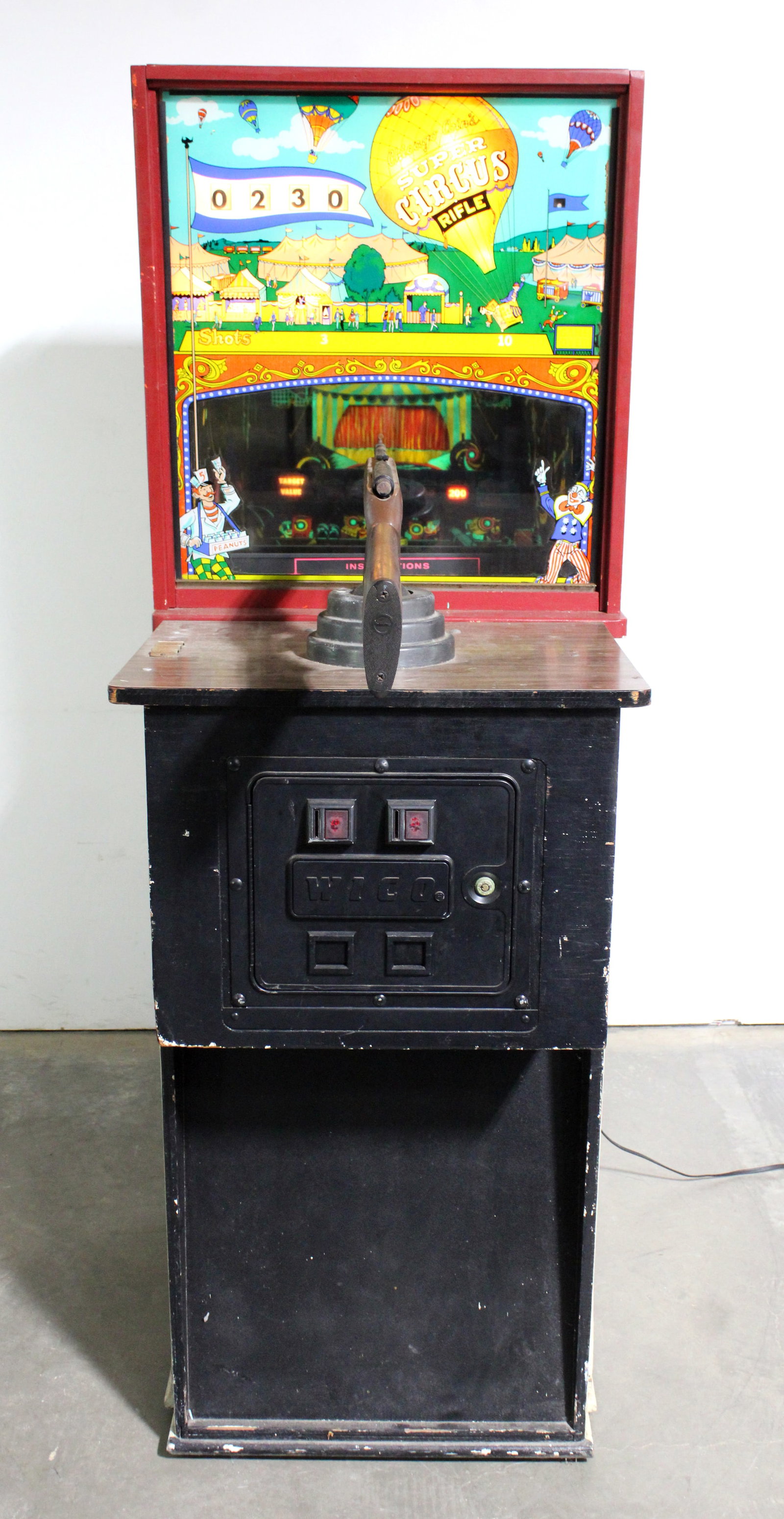 Chicago Coin Super Circus Rifle Gallery: Lights up, shoots but won't score. This item requires third-party shipping or pickup arrangements to be made. Dimensions: 72 x 26 x 46