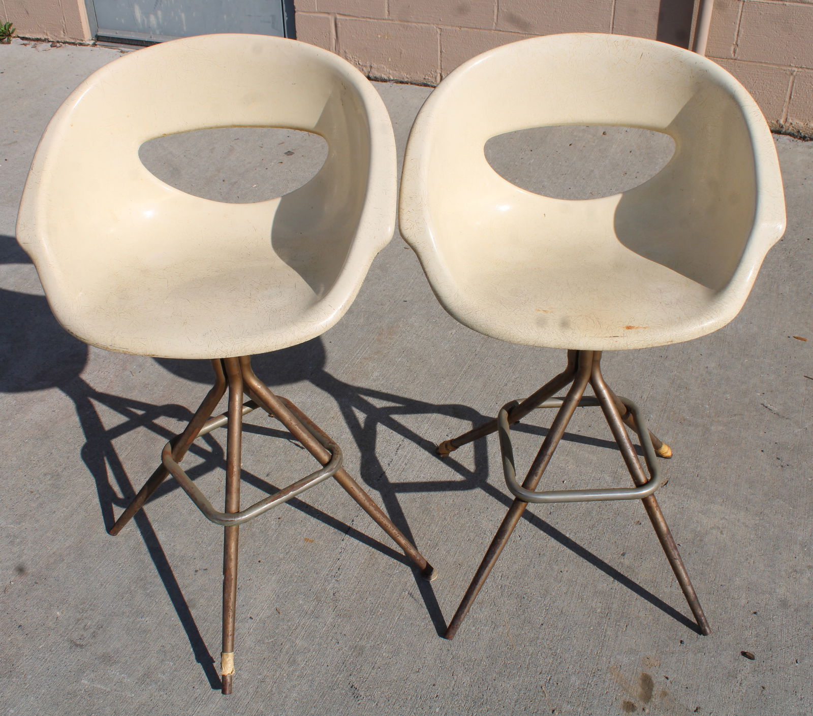 MCM Joal Fiberglass Bar Stools: This item requires third-party shipping or pickup arrangements to be made. Dimensions of one: 34 x 22 x 18, seat height 24.