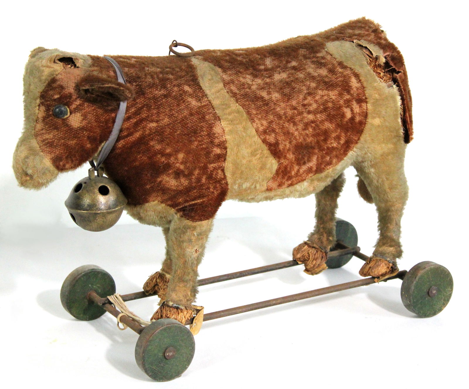 Mohair Cow Child's Ride On Toy, Circa 1900: Sold as-is, with losses, tears, and open spots. This item requires third-party shipping or pickup arrangements to be made. Dimensions: 14 x 9 x 22