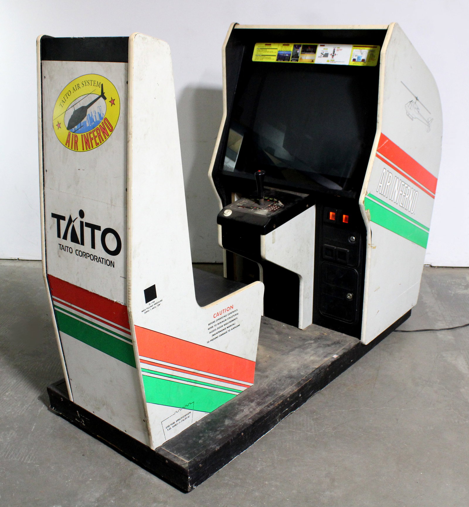 Taito Air Inferno Sit Down Arcade Game: Not working. This item requires third-party shipping or pickup arrangements to be made. Dimensions: 54 x 31 x 72