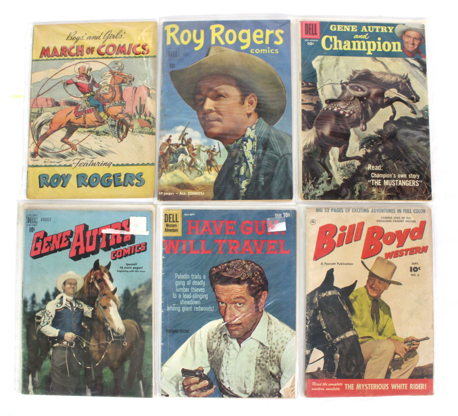 Western Comic Mix Lot Incl. Gene Autry, Bill Boyd and Roy Rogers: Total of 6 Issues. Assorted issues. Bagged and Boarded. Varying conditions. In-house shipping available.