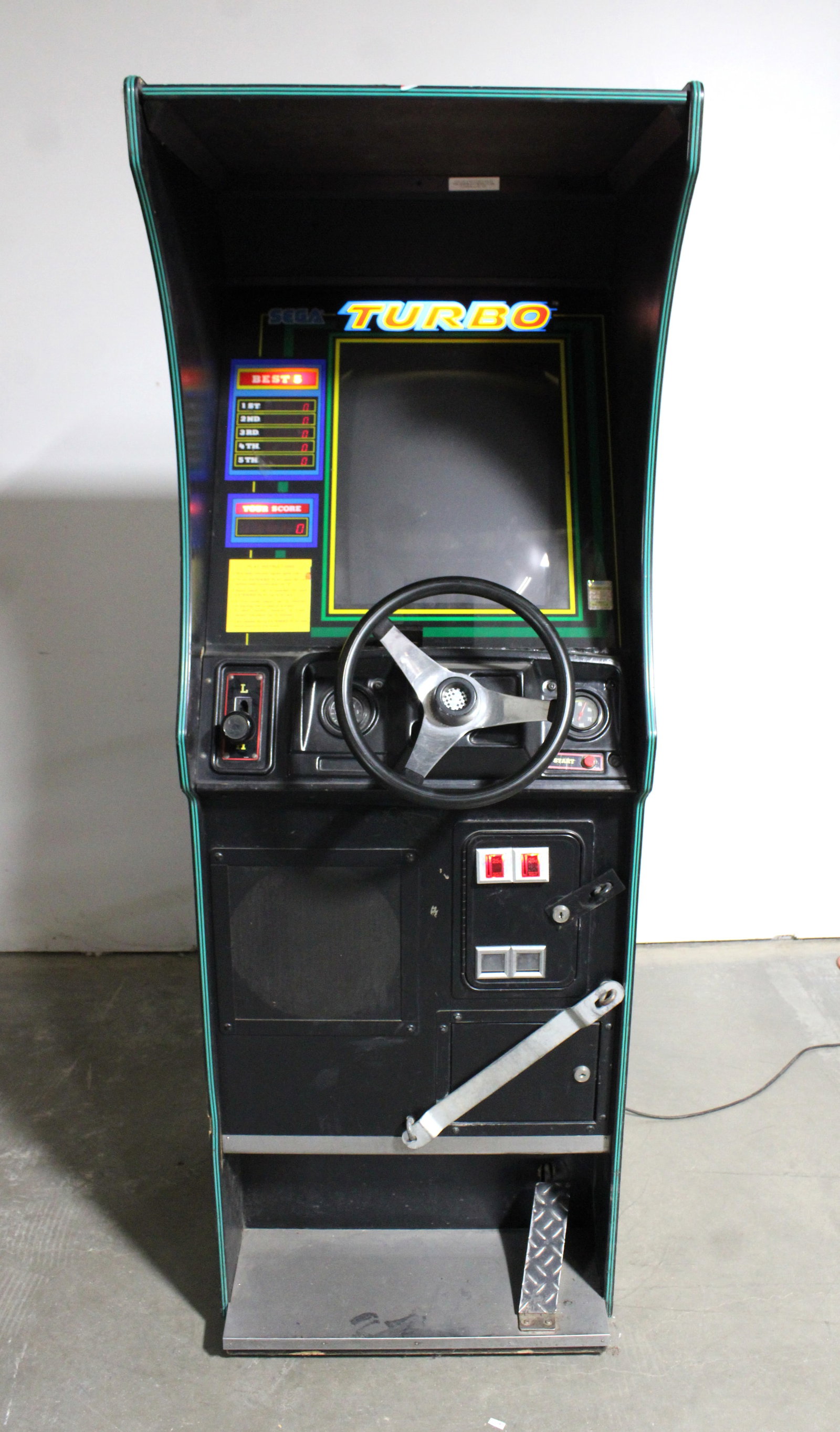 Sega Turbo Arcade Game: Powers on, not working. Locked, no key. This item requires third-party shipping or pickup arrangements to be made. Dimensions: 73 x 25 x 36