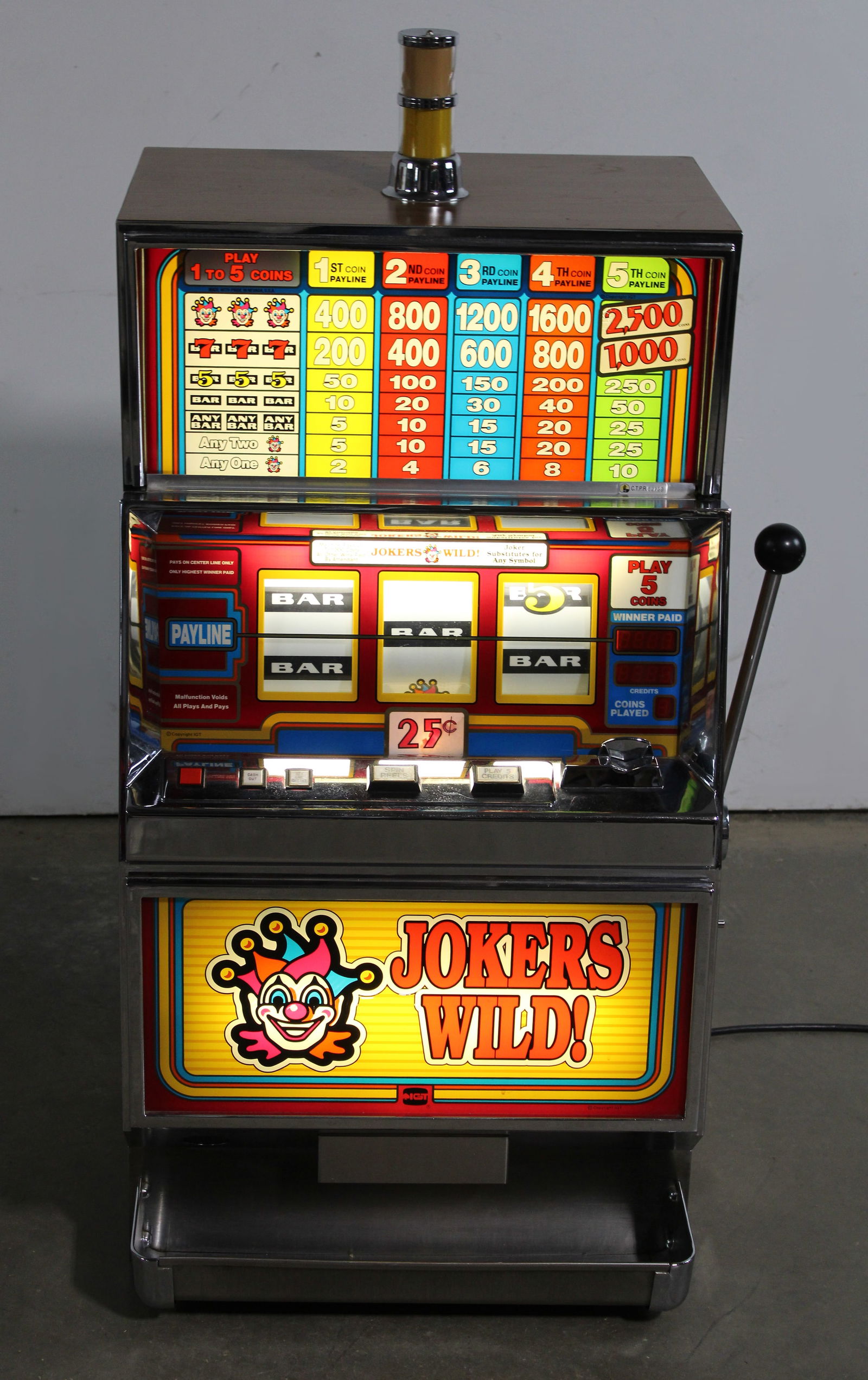IGT Jokers Wild! Slot Machine: Powers on, not working. This item requires third-party shipping or pickup arrangements to be made. Dimensions:46 x 24 x 22