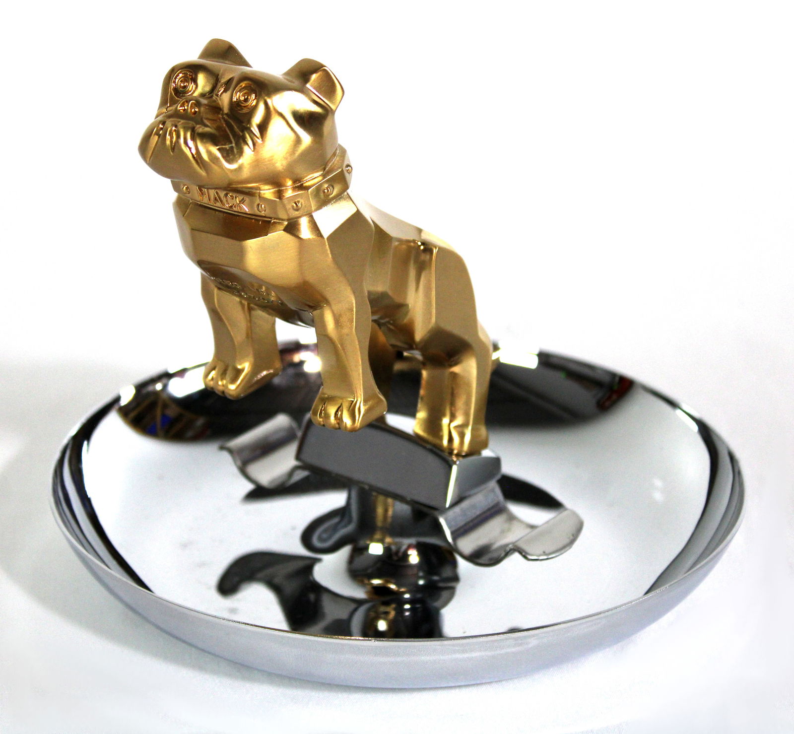 Mack Cigar Ashtray, Chrome and Goldtone: Mint condition. In-house shipping available. Dimensions: 7 x 7 x 7