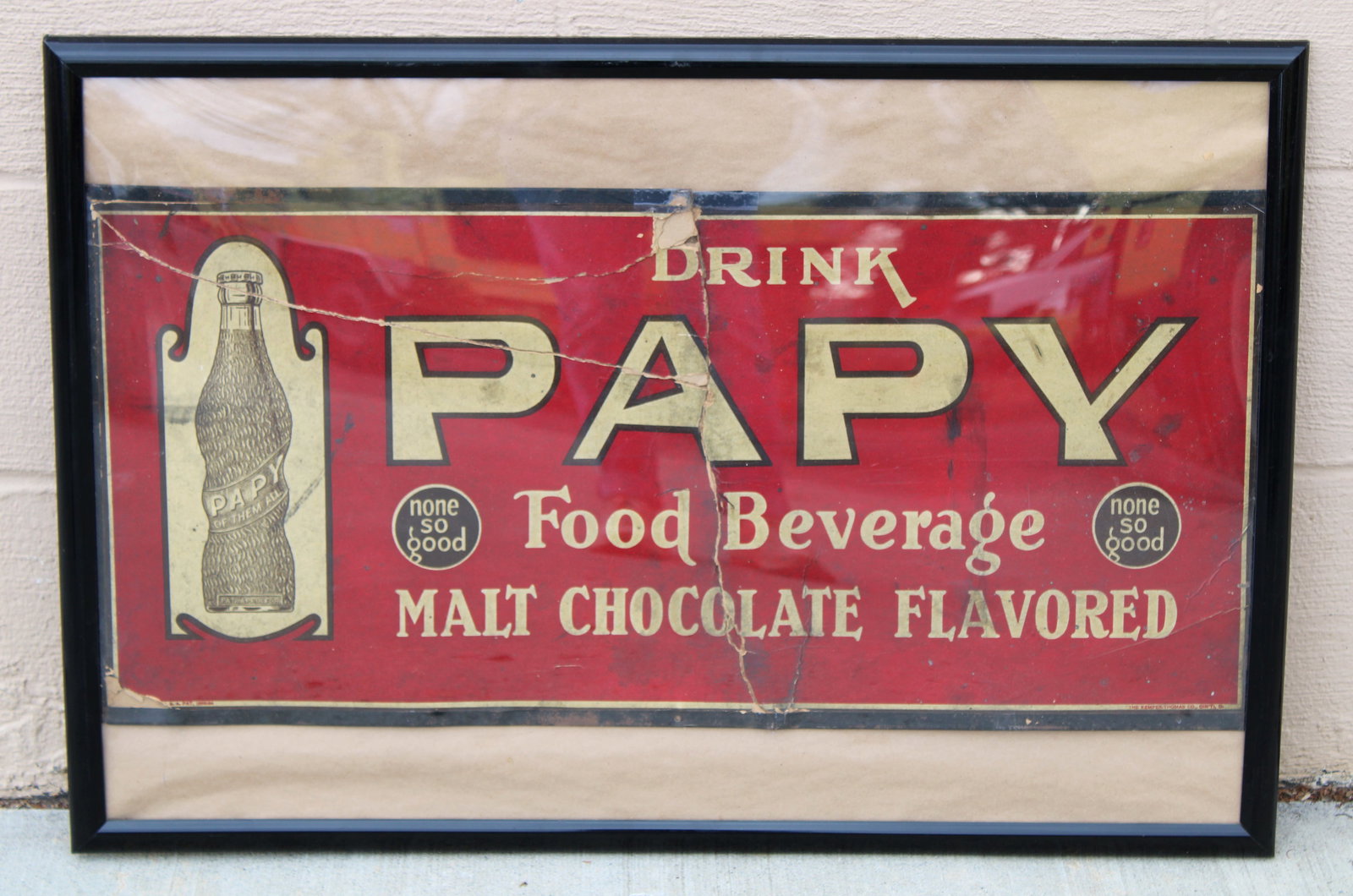 Drink Papy Cardboard Advertising Sign: This item requires third-party shipping or pickup arrangements to be made. Dimensions of frame: 21 x 31