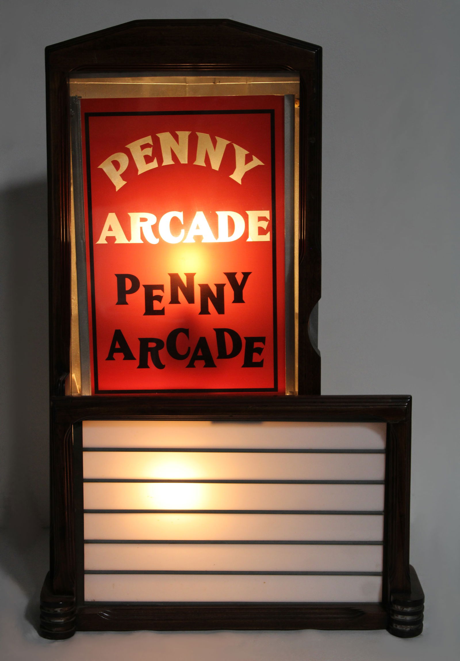 Penny Arcade Glass Front Lighted Marquee: Working. This item requires third-party shipping or pickup arrangements to be made. Dimensions: 31 x 20 x 9