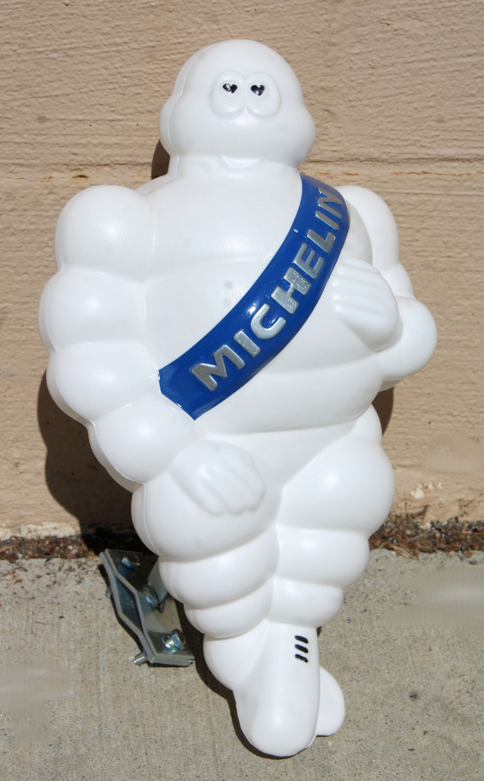 Michelin Man Blow Mold on Bracket: This item requires third-party shipping or pickup arrangements to be made. Dimensions: 12 x 9 x 6