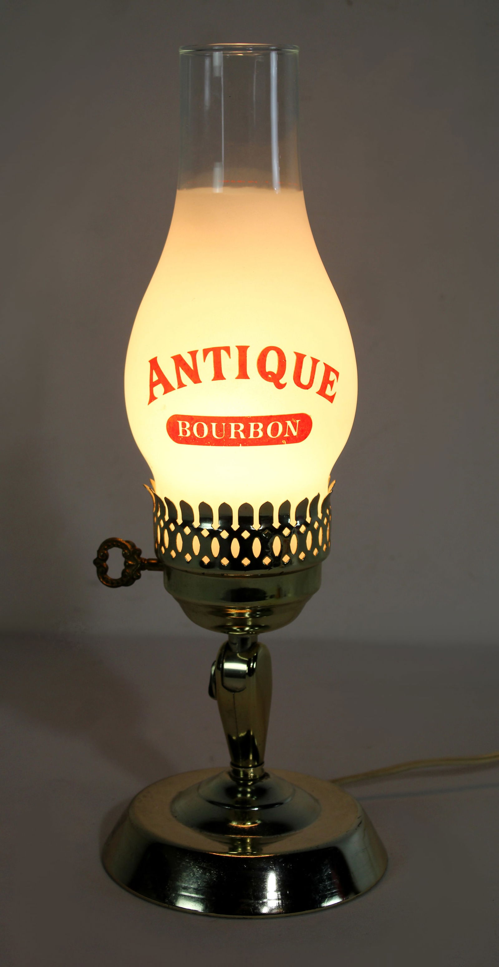 Antique Bourbon Light: Working. This item requires third-party shipping or pickup arrangements to be made. Dimensions: 15 x 6 x 6