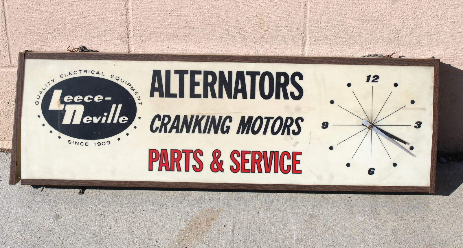 Leece- Neville Automotive Clock Light Up Sign: This item requires third-party shipping or pickup arrangements to be made. Dimensions: 13 x 37 x 4