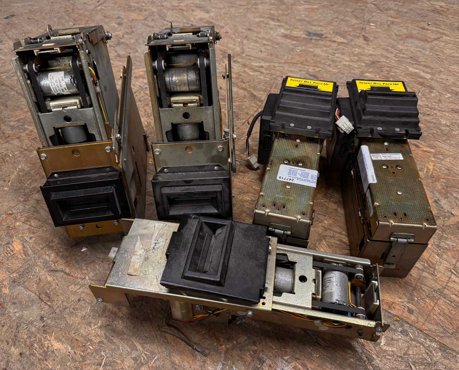 Dollar Bill Acceptors Assorted, Lot 1: Total of 5. untested. **In-house shipping available. Please reach out to auction house prior to pickup day if you are needing this item shipped.