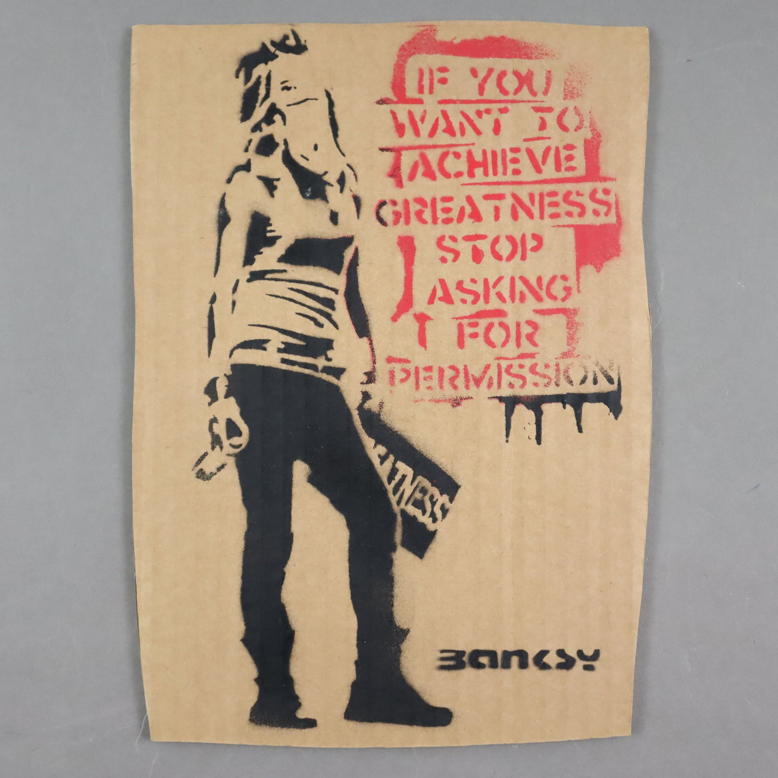 Banksy (*1974 Bristol, nach) - "If You Want To Achieve Greatness", 2015, Souvenir aus der: Banksy (*1974 Bristol, nach) - "If You Want To Achieve Greatness", 2015, Souvenir aus der Ausstellung "Dismaland" in Weston-super-Mare in Somerset, Pochoir-Druck (Schablonengraffiti) auf Pappe mit une