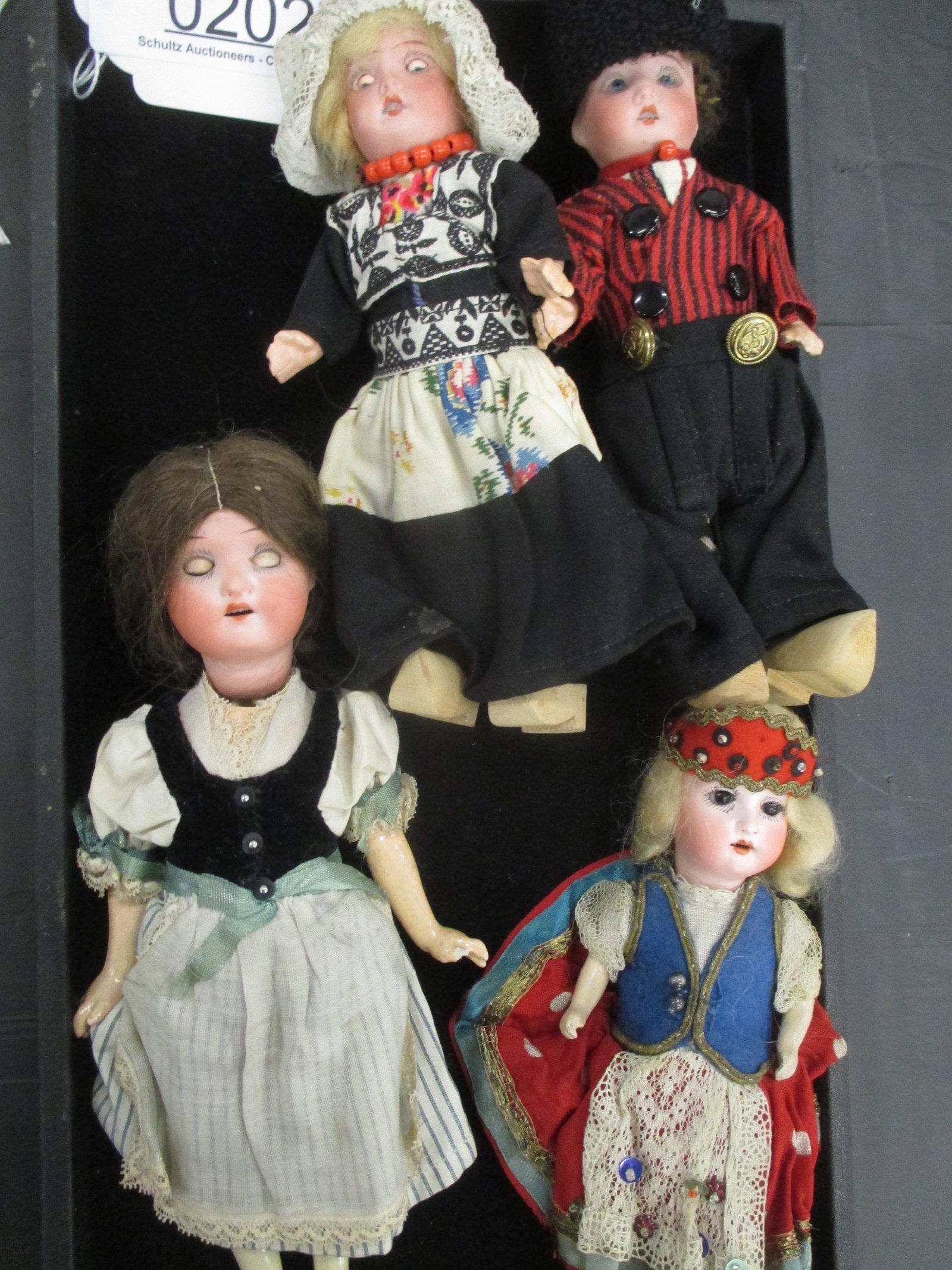 4 BISQUE HEAD DOLLS (1 of 2)
