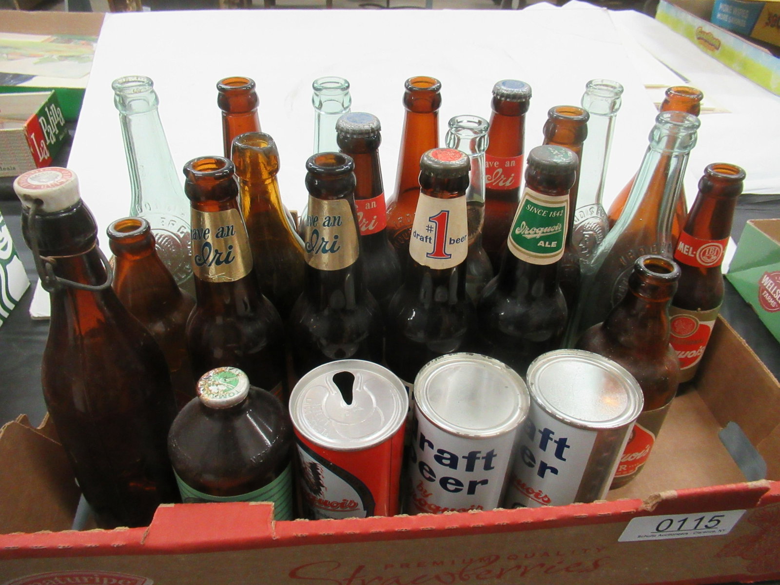 Group of Assorted Iroquois Beer Bottles and Cans: Group of Assorted Iroquois Beer Bottles and Cans