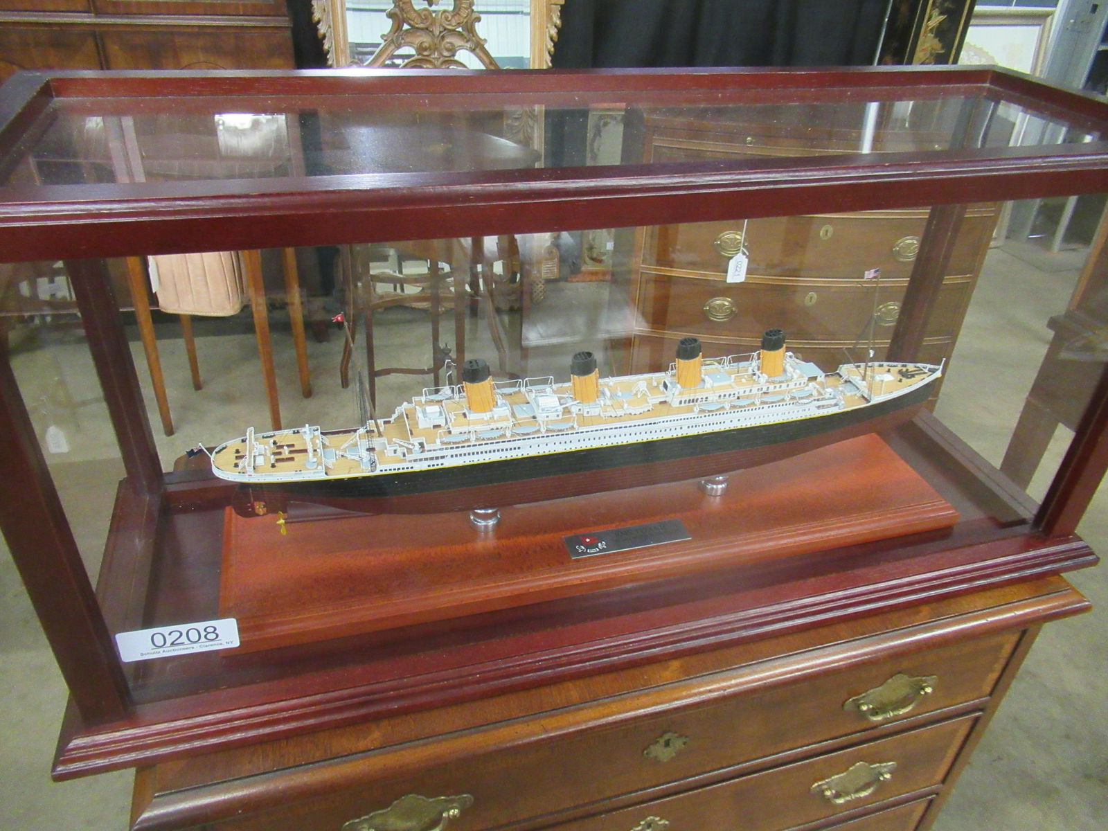 Ships Model of Titanic in Glass + Wood Display: Ships model of Titanic in glass and wood display case, Approx. 14" h x 31" w