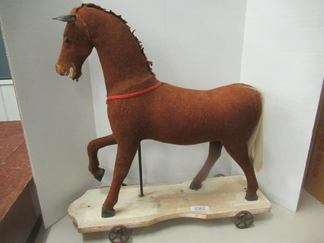 Hobby Horse with Wooden Teeth and Hooves: Hobby Horse with Wooden Teeth and Hooves, on Platform with Iron Wheels approx. 29.5"l x 30"h x 10"w