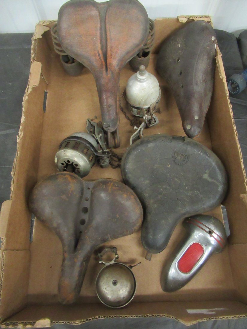 Lot of Antique Bicycle Seats and Accessories: Lot of Antique Bicycle Seats and Accessories