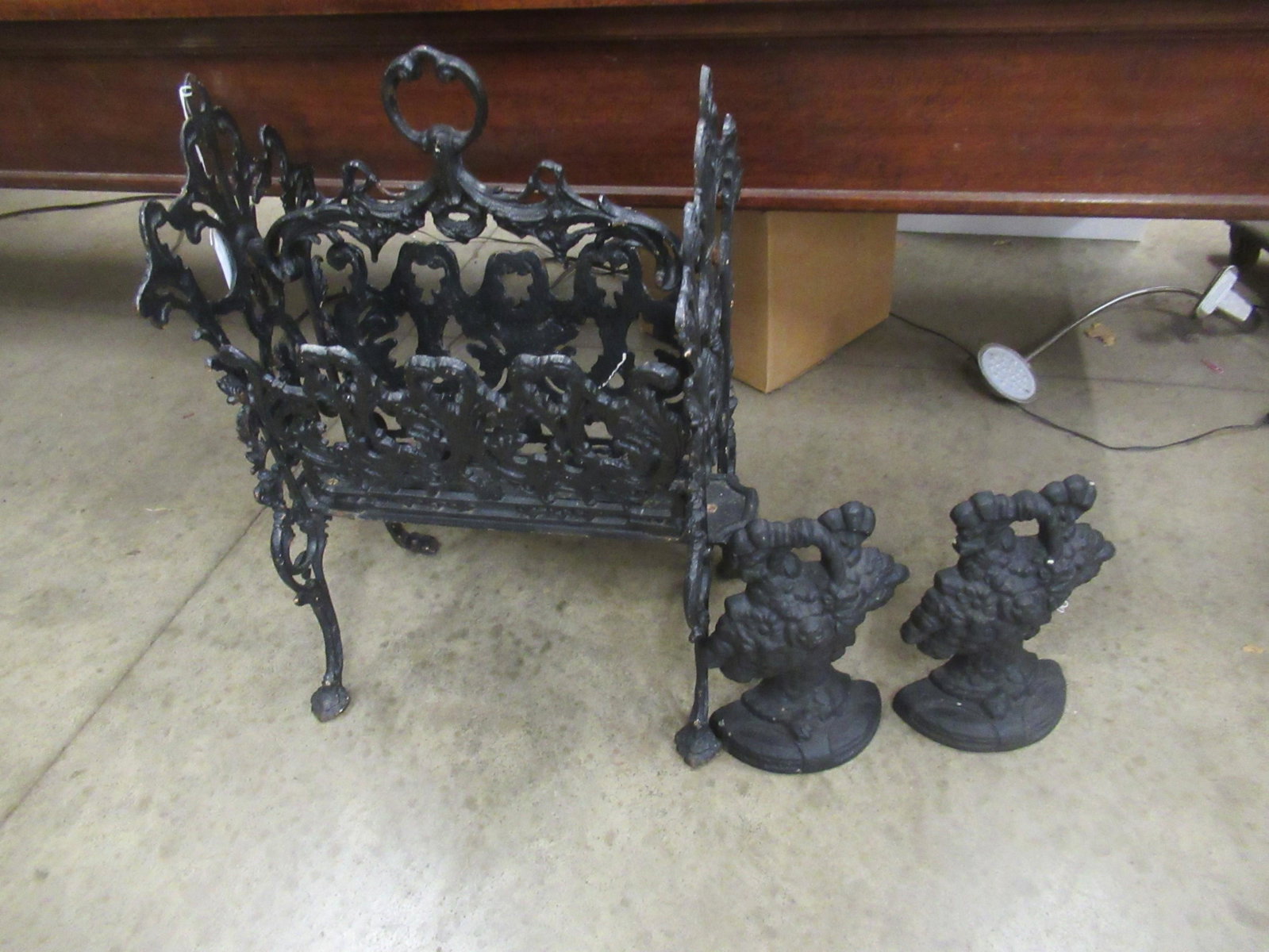 Ornate Cast Iron Newspaper Holder & Doorstops: Ornate Cast Iron Newspaper Holder & Pair of Cast Iron Doorstops -