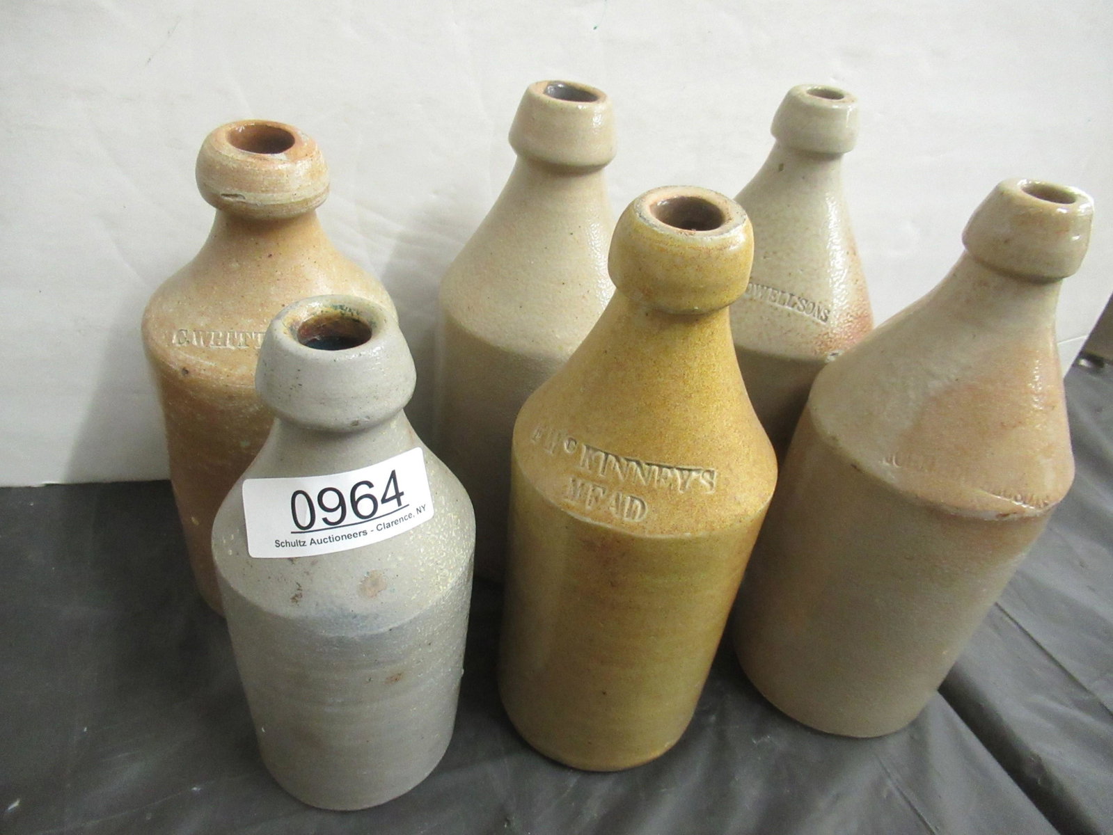 6 Stoneware Bottles: 6 Stoneware Bottles incl G. Wittenmore, John Howellsons, Etc -