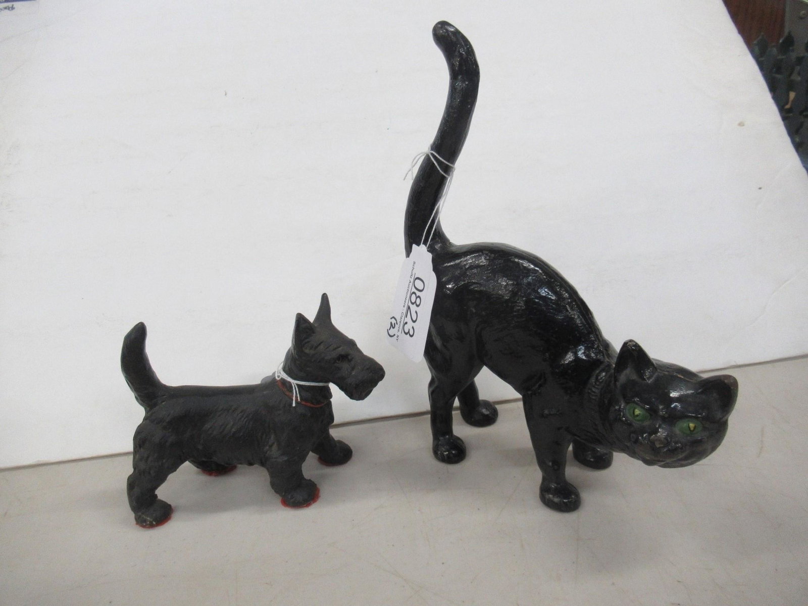 Cast Iron Black Cat and Scottie Dog Door Stops: Cast Iron Black Cat and Scottie Dog Door Stops - Cat approx 7.5" x 10.5" and dog approx 6.5" x 5"