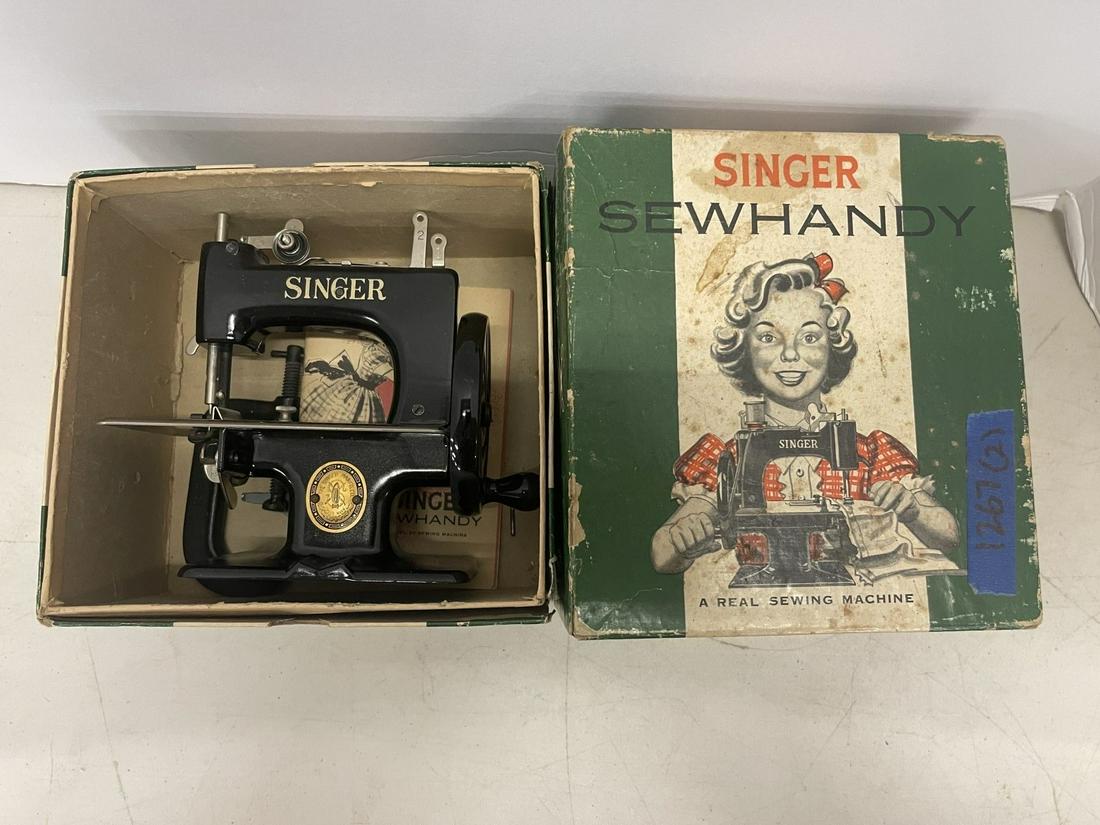 2 Sewing Machines incl 1 Singer "Sew Handy": 2 Sewing Machines incl 1 Singer "Sew Handy" Sewing Machine in Original Box and Older singer sewing machine inside a Sew Handy Box -