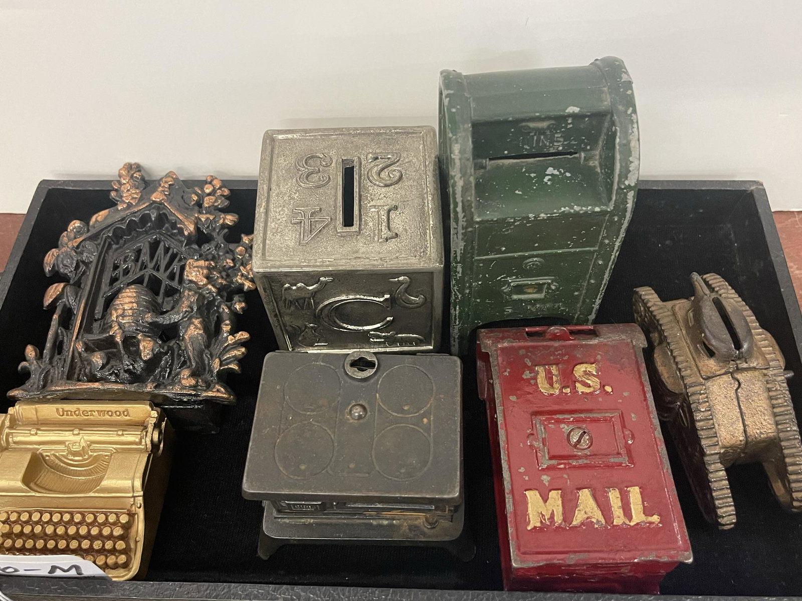 Lot of 7 Novelty Cast Iron Banks: Lot of 7 Novelty Cast Iron Banks, Tank, Typewriter, Stove, Beehive -