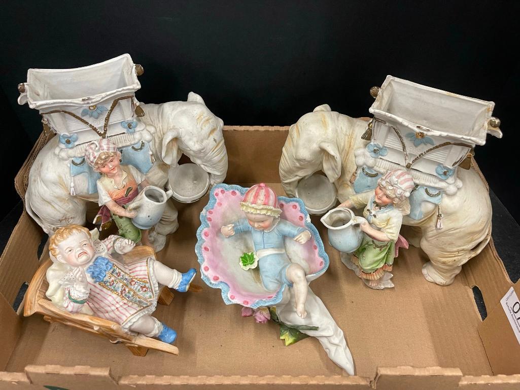 Unusual Pair Bisque Elephant Vases: Unusual Pair Bisque Elephant Vases with figures etc approx 9" x 5" x 8"