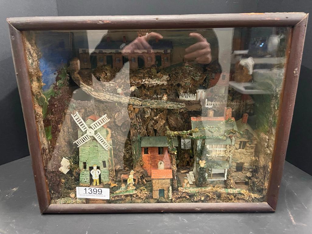 Folk Art Diorama "Hillside Village" in Glass Case: Folk Art Diorama "Hillside Village" in Glass Case approx 12" x 19" x 15"