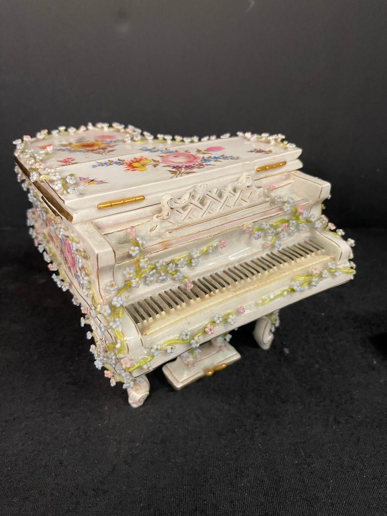 Porcelain Grand Piano w/ crossed swords mark: Porcelain Grand Piano w/ hinged lid, crossed swords mark, minor flower chips, approx 6" x 7.5" x 7"