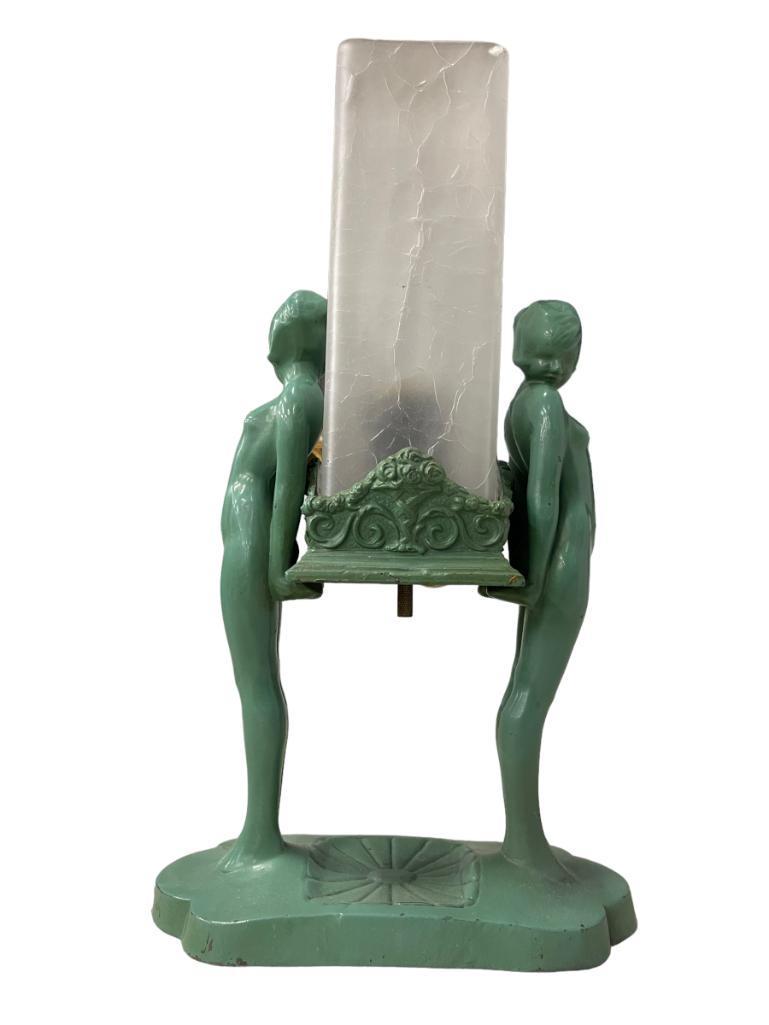 1920's Frankart Lamp w/ Twin Nude Figures: Frankart twin nudes L221 w/holder in orig. green finish with green square crackle glass shade. Patent design number 78419, shade 2-1/2”sq x7”h
