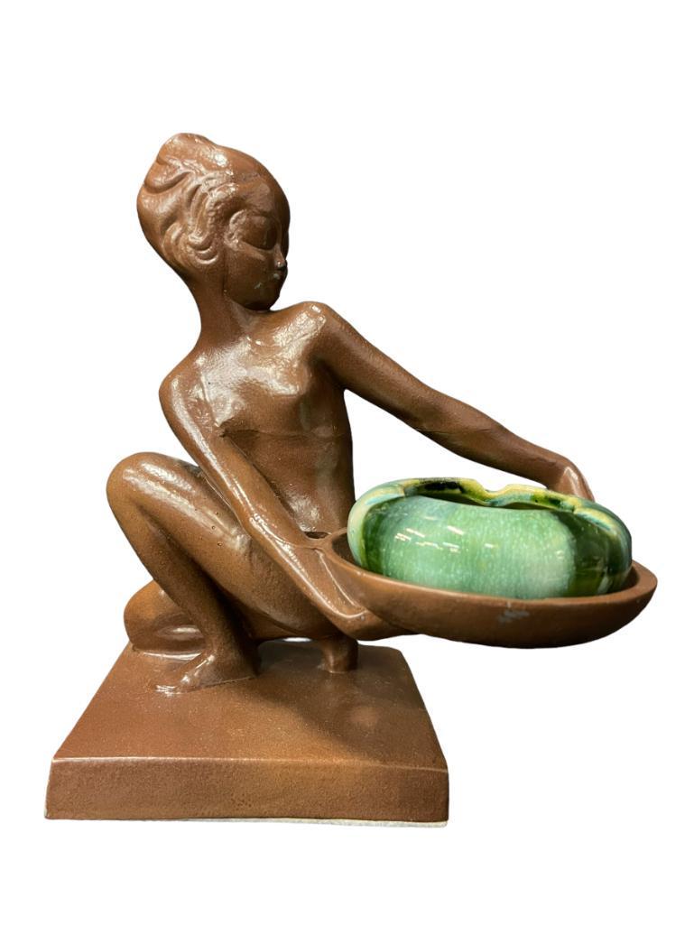 Frankart Ashtray w/ Brush-McCoy Pottery Insert: Frankart Ashtray Combination Pert Nude Replete w/Rhythmic Lines Shape #T383, Kneeling Alien Girl Holding a Tray, 9”h x 5”l x 4”d, Tray holding green mottled Brush-McCoy orig. pottery ashtray ins