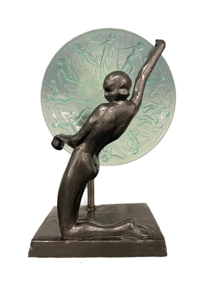 Frankart Kneeling Nude Lamp w/ Lighted Disc: Frankart Kneeling Nude Silhouette Girl L244 11"H x 4"W Holding Aloft a 6-1/2"disc Lighted w/green Consolidated Dancing Nudes plaque glass in collection in Gunmetal finish
