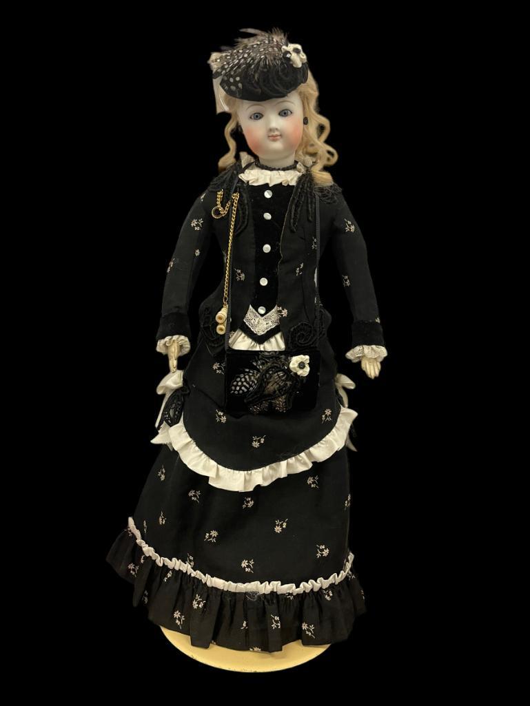 French Fashion Doll with Bisque Head: French Fashion Doll with Bisque Head, leather body, closed mouth, glass eyes, kid body "dressed for the opera" head appears to be unmarked, approx. 17"