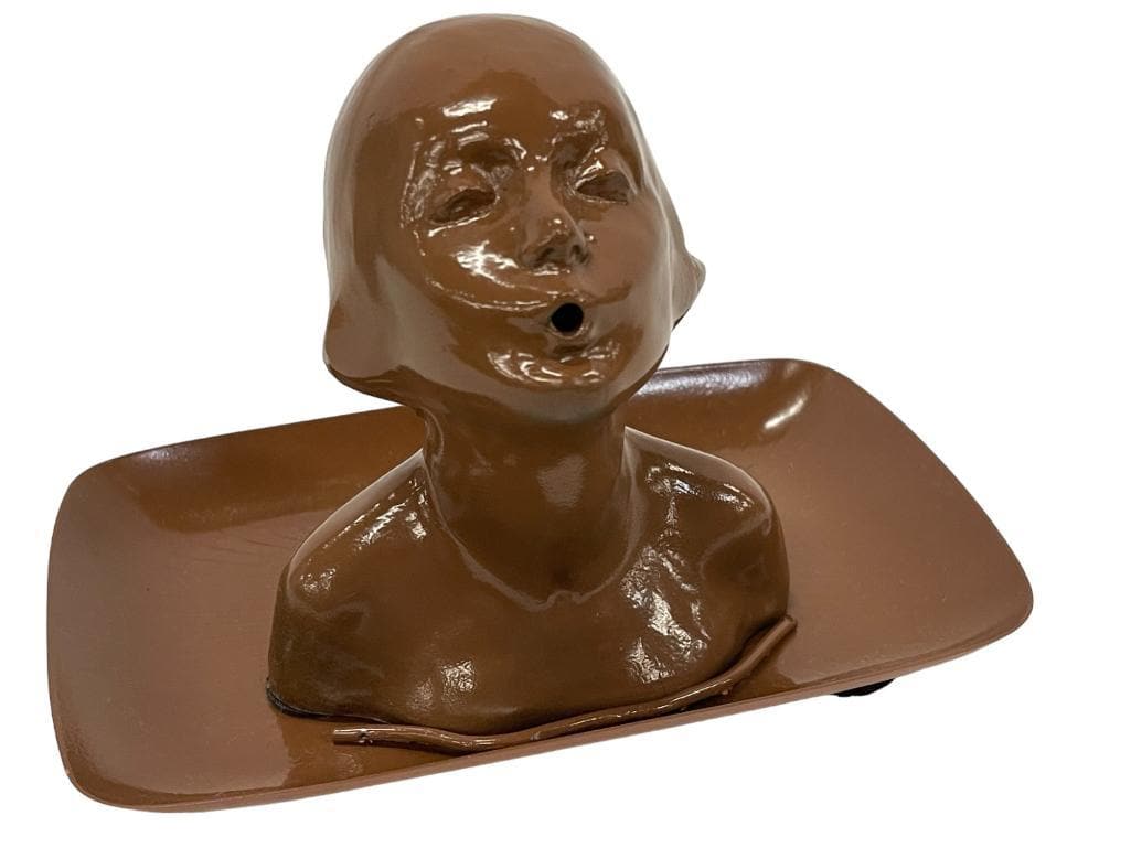 1923 Incense Burner: Frankart 1923 incense burner nude girls head with open mouth for exiting incense smoke. Sits atop a tray base w/ etched sunrays. Restored to original brown. Approx. 4 1/2"H x 4 1/4" W girl.