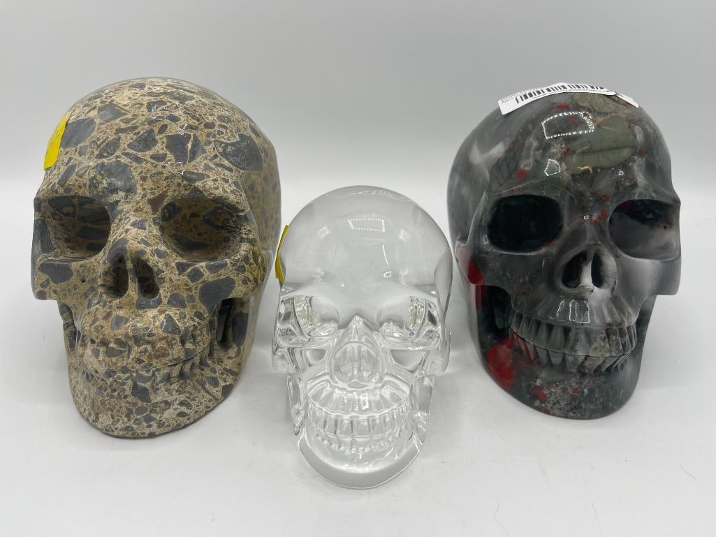 2 carved stone skulls and one glass skull (1 of 6)