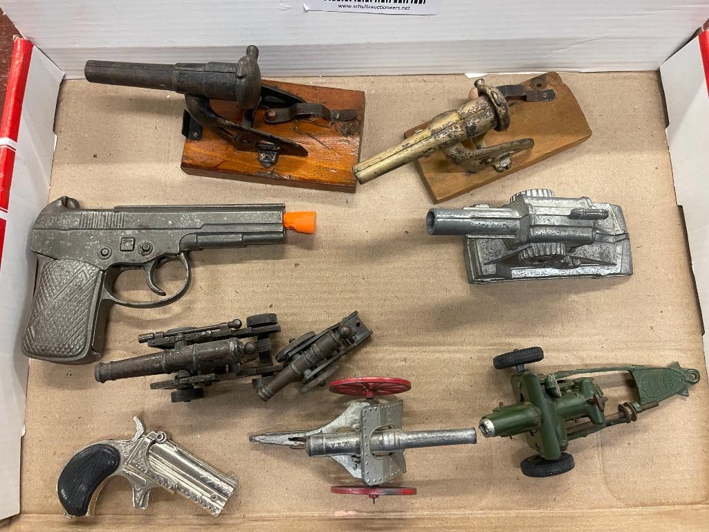 Group of toy cap guns and cannons: Group of toy cap guns and cannons. 9 pieces.