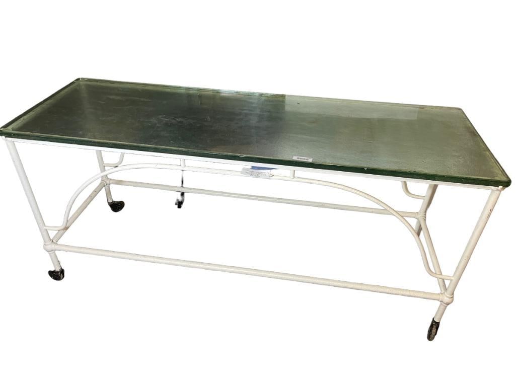 Antique glass top surgeons operating table: Antique glass top surgeons operating table. Some chips in glass. 33x72x24 in. Provenance: Deaccession from Clarence Historical Society