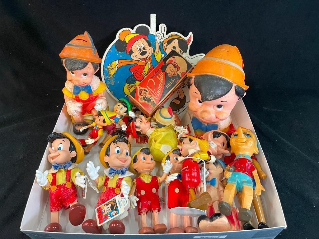 Mixed lot of Pinocchio figures, banks and more.: Mixed lot of Pinocchio figures, banks and more. Some marked Disney, some Ideal. Movie cardboard displays. Approx. 18 pieces. bank 12x5x5 in.