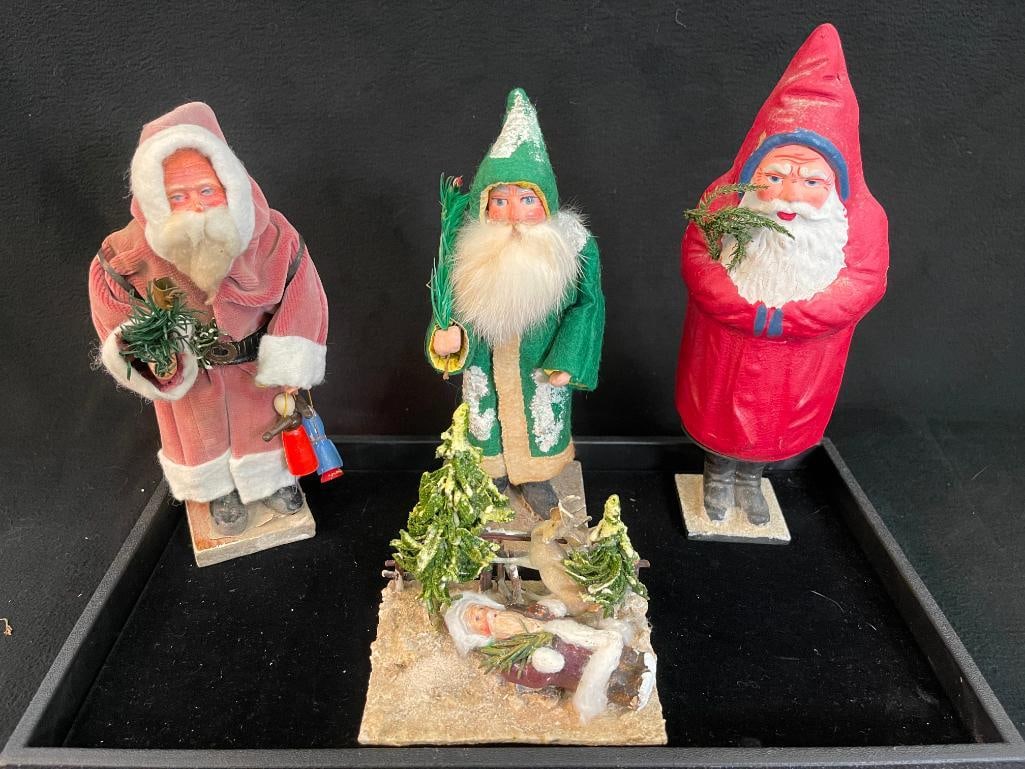 Group of 4 antique Santa figurines. Some marked Germany: Group of 4 Antique Santa figurines. Some marked Germany. 4 pieces. 10x4x4 in.