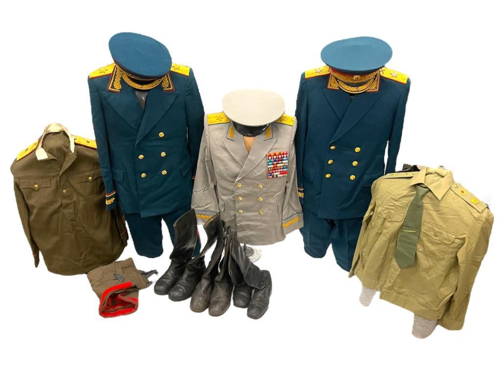Mixed lot of Soviet uniforms, boots, shirts and more: Mixed lot of Soviet uniforms including Summer Air Force jacket, Artillery Marshall, boots, shirts and more. Approximately 17 pieces. 34x24x4 in.