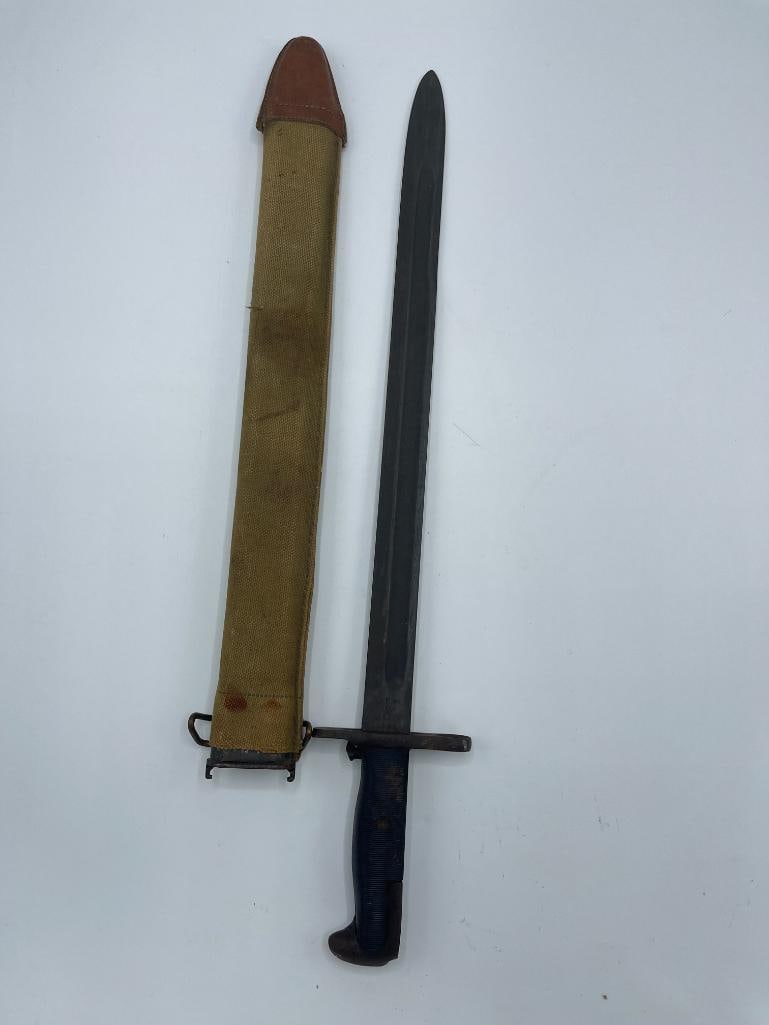 1942 UFH marked bayonet: UFH marked U.S. bayonet 1942 and scabbard. 22x4x4 in. Provenance: Deaccession from Clarence Historical Society