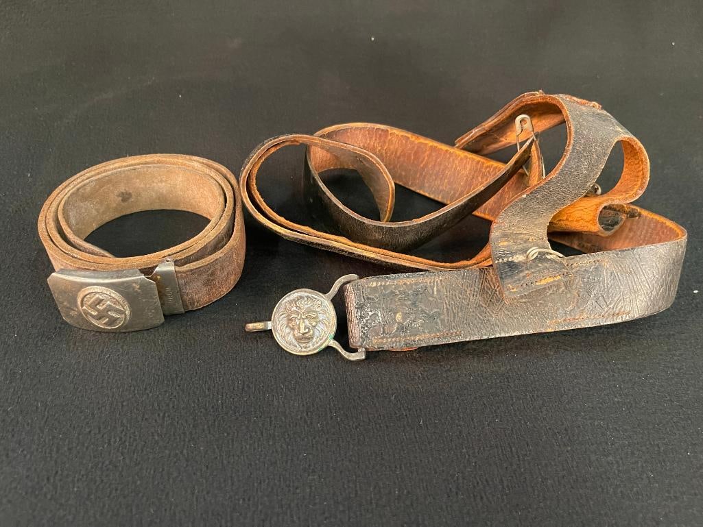German WW2 sympathizer belt buckle with leather belt and Lion face buckle: German WW2 sympathizer belt buckle with leather belt and Lion face buckle with leather belt and frog. 2 pieces. 4x4x6 in.