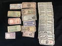 Group of U.S. $2 bills and foreign currency